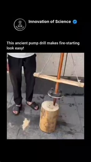 Innovation of science on Instagram: "This ancient mechanical tool uses a flywheel and a sliding crossbar to produce rapid rotation. As the user pumps the crossbar up and down, a cord winds and unwinds around the spindle, while the weighted disc stores rotational energy and keeps it spinning. The high-speed motion creates strong friction at the tip, heating fine wood dust until it reaches its ignition point and catches fire. Used for centuries by many Indigenous and early civilizations, the pump 