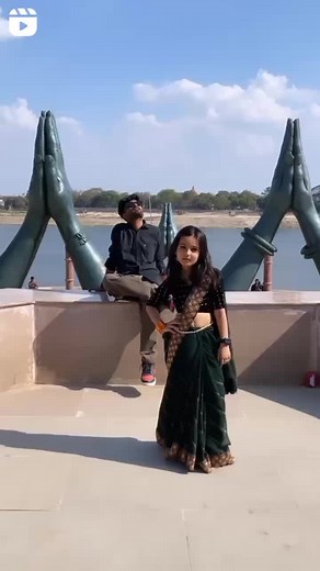 Synchronized Dance Performance by River in Traditional Attire