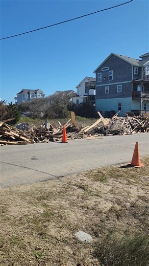 Debris brought to the side of Old Lighthouse Rd in anticipation of the roadside pick up by Dare County. | North Carolina Beach Buggy Association