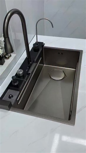 FD-Tiles For Life on Instagram: "Presenting our ultra high-tech multifunction kitchen sink — where gold and black sophistication meets intelligent engineering. Designed with advanced features including touchless operation, sensor-based water flow, ambient LED blue lighting, and integrated tools and accessories — all crafted to elevate everyday kitchen performance. Ideal for contemporary kitchens that expect seamless design, efficiency, and luxury in one statement piece. Available now at FutureDe