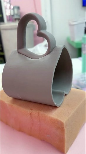 Let’s talk decals!! The process for this mug was totally wild!🤪We started with digitally designing the decals- one sheet for color, and another for gold, knowing that they would have to be applied at different stages and fired to separate temperatures, but meant to fit together perfectly. Then the wet clay process began, which included hand painting flowers and precise carving to account for exact clay shrinkage to ensure the rhinestones would fit perfectly. All of these layers of information h