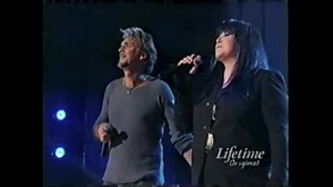 "Almost Paradise... Love Theme from Footloose" is the title of a duet by singers Mike Reno of Loverboy and Heart's frontwoman Ann Wilson. It is one of two major hits with music by singer Eric Carmen and lyrics by Dean Pitchford, the other being Carmen's hit, "Make Me Lose Control". Reno is best known as the lead singer of the rock band Loverboy, while Wilson is the lead singer of the rock band Heart. Both bands achieved a significant amount of success in the 1980s, and Reno and Ann Wilson were a