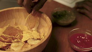 Man eating tortilla chips | Free Stock Video Footage