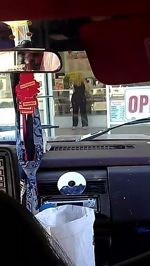 Lady doing pee pee dance at the Donut shop