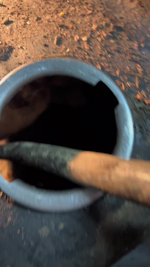 Inspecting a Dirty Metal Pipe with Precision Tools