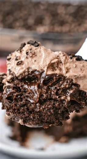 Easy & Classic Oreo Dirt Cake This is the ultimate layered chocolate dessert. Moist chocolate cake soaked with hot fudge, layered with creamy pudding, topped with fluffy cool whip and crushed Oreos. Chilled, rich, and perfect for parties or family gatherings. Ingredients Cake 1 box chocolate cake mix (plus ingredients on box) Pudding Layer 12.8 oz hot fudge 3.4 oz chocolate instant pudding mix 1 ¾ cup milk Topping 3.4 oz chocolate instant pudding mix 1 ¾ cup milk 8 oz cool whip, thawed 30 Oreos,