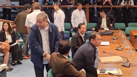 BONOAN AT ALCANTARA SA SENADO Former DPWH District Engineer Henry Alcantara approaches former Secretary Manuel Bonoan before the Blue Ribbon hearing on flood control issues resumes. | via Maeanne Los Banos/News5 | ONE News
