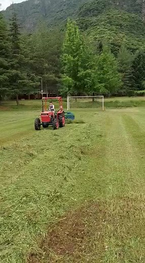 Tractor Operations: Baling Hay in Scenic Fields