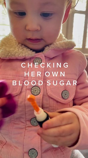 Toddler Checking Blood Sugar with Glucometer