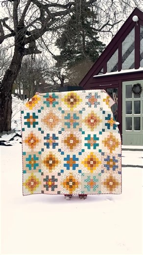 Helene Moe Slinning on Instagram: "My scrappy Pine trip quilt is here! 🌲 I’ve been wanting to make a scrappy version of this quilt pattern for so long, and I finally finished it the other night. I bribed my youngest son into filming while I did the classic quilt reveal roll in front of my greenhouse. 😅 Pattern: #pinetripquilt by me @scandiquilts Fabrics: Mostly @rubystarsociety Quilting: Diagonal Crosshatch on my domestic machine Backing & binding: Red cotton gingham This one’s already so soft