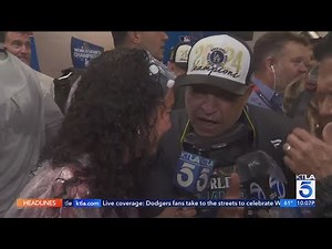 Dodgers players celebrate in the locker room after their World Series win