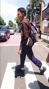 Stop.!! There are school children crossing the road at the zebra crossing.