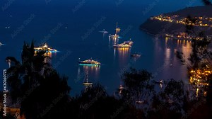 Luxury yachts at night, time-lapse, French Riviera, France, 4K