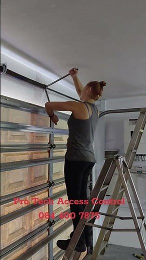 Winding of torsion springs for a double garage door. #garagedoorsprings #garagedoorrepair