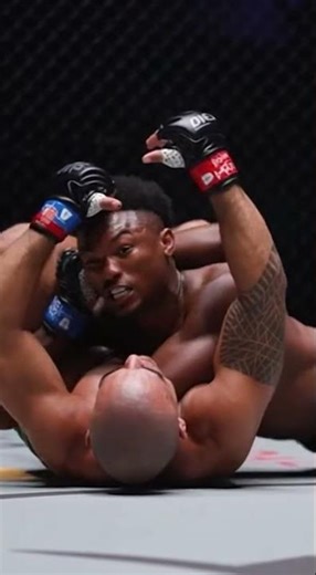 ONE Championship ground battle fighter attempts a guillotine choke Camera low mat level shot ca