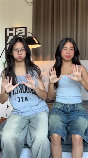 Sisters Communicate Through Sign Language Gestures