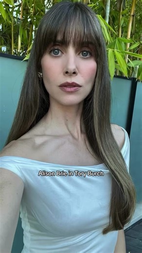 Alison Brie wearing the jersey hoop dress with the mini kira diamond quilt top-handle purse. Styled by Erin Walsh @Erin Walsh. #AlisonBrie #FashionTrustAwards #TikTokFashion