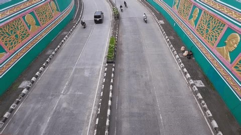 clip-3985574695-various-types-vehicles-passing-through-underpass-jendral
