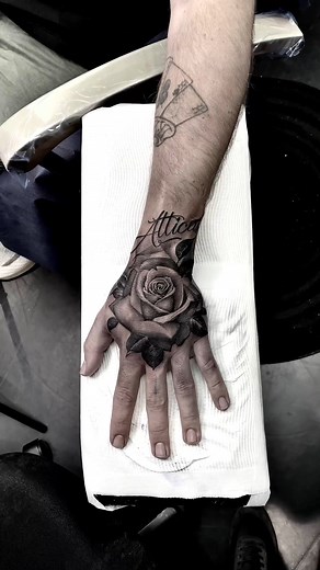 A rose tattoo on the hand — delicate, but powerful. It represents beauty that survives through pain. Each petal is a story of something that once hurt and bloomed anyway. The hand placement gives it meaning — it’s always visible, always present, a symbol of resilience and grace that you carry every day. In black and grey realism, every fold, every shadow, and every highlight makes it feel alive. It’s more than a flower — it’s strength, love, and transformation etched into the skin. Art that does