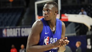 The U.S. revoked visas from a top basketball player's country. How the NBA kept his dream alive.