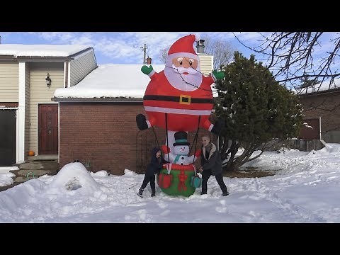 Putting Santa Hot Air Balloon Inflatable Outside in the Snow! Christmas Holidays Yard Inflatables