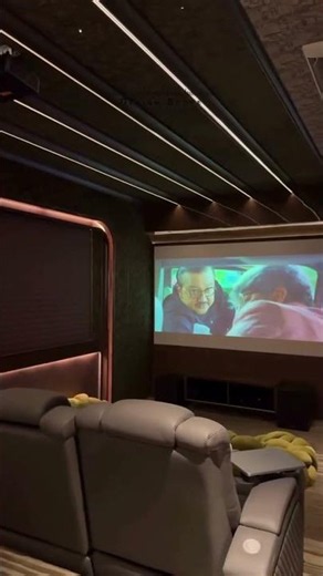 This home theater is designed for complete immersion, blending moody