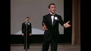 As one of the most famous show tunes of all time, "You Are My Lucky Star" is intrinsically linked to the classic film "Singin' in the Rain" (1952). Although originally composed for a different film, the song became an integral part of the masterpiece starring Gene Kelly and Debbie Reynolds. Gene Kelly's performance as Don Lockwood brought a heartfelt, romantic feeling to the song, while Debbie Reynolds added her own charm and sweetness. The song was written by Nacio Herb Brown (music) and Arthur