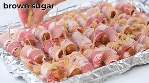 4.3K views · 15 reactions | Four simple ingredients are all you need to create these savory yet sweet appetizers! https://www.favfamilyrecipes.com/bacon-wrapped-lil-smokies/They are a great party or appetizer dish that is always crowd-pleasing. These bacon-wrapped smokies are a balance of sweet, savory, and a hint of salty deliciousness! | Favorite Family Recipes | Facebook