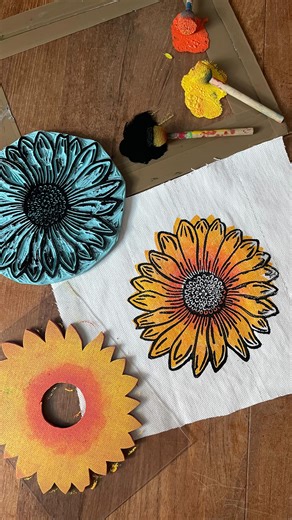 Made By_ on Instagram: "Here’s how I make a double layered stamp 🌻 I carve the detailed layer in rubber - the petals, the seeds, the tiny lines. For the background shape, I glue two sheets of foam rubber together, cut them, and mount the stamp on an acrylic sheet so it’s see-through. You can carve the background in rubber too - but to me, it feels unnecessary. Foam rubber is cheaper, easy to cut, perfect for holding colour, and surprisingly durable. When I make background stamps, they are usual