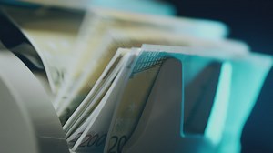 Close up to a counting money machine - Free Stock Video