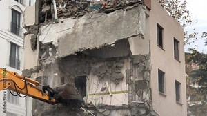 4K Construction Building - Demolition digger destroying an old building - Demolition of apartment block - Medium shot of house being demolished - Building demolition with scoop - Disintegration