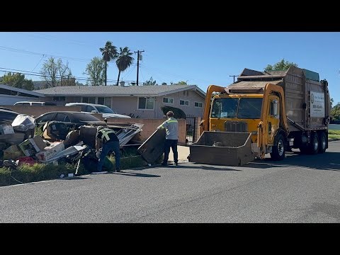Valley Vista Services Front Load Garbage Truck on a Large Bulky Item Pile!