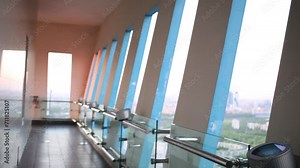 Interior of viewing platform in high-rise building with windows
