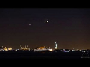 A Time-stack time-lapse of the crescent moon setting over the Statue of Liberty National Monument​