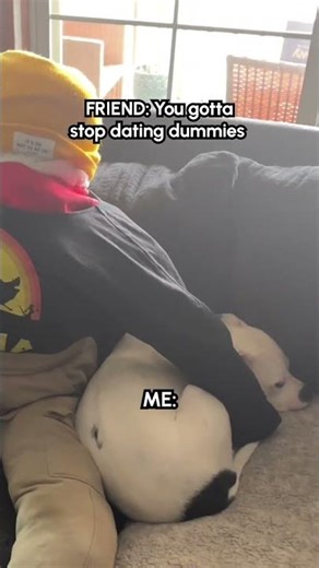 Dog Loves Cuddling With Dummy On Couch