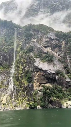 Misty Waterfalls and Dramatic Cliffs in Milford Sound Fjord