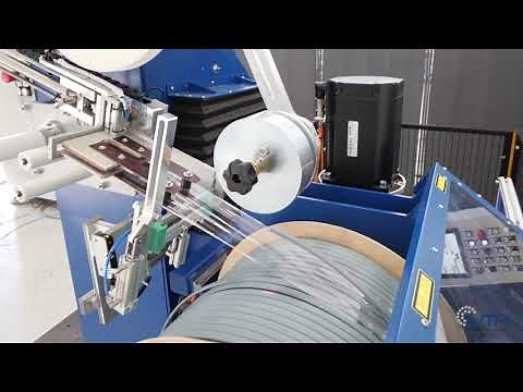 Rewinding line with semi-automatic spooler