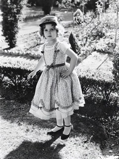 115K views · 2.8K reactions | Shirley Temple Full length portrait of Shirley Temple, US child actress, wearing a full print pattern dress and a baseball cap, posing with her hands on her hips in a garden, circa 1935. (Photo by Silver Screen Collection/Getty Images) | Be Inspired | Facebook