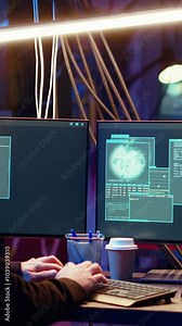 Vertical video Hacker happy after successfully doing computer sabotage using encryption trojan ransomware in hidden base. Cybercriminal demands ransom money from victims after gaining access to their