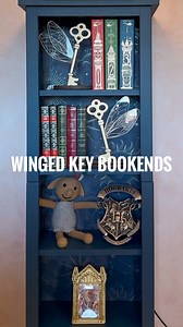 Winged key bookends 😍 These stunning wooden bookends are made by @mifflinmadeco and are such a cute addition to Alma’s ravenclaw bookshelf 💙 although I might steal them for my shelves because I like them too much 😅 The code JENNIFER10 saves you 10% on all purchases from @mifflinmadeco {brand rep / gifted} #harrypotter #bookstagram #harrypotterfan #harrypotteredit #wizardingworld #ravenclaw #hogwarts | Adventuresofwander