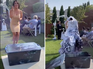 WATCH: Bride dyes her dress with coloured smoke whilst guests sit patiently...
