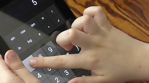 Child Makes Arithmetic Calculations Calculator Stock Footage Video (100% Royalty-free) 15386335 | Shutterstock