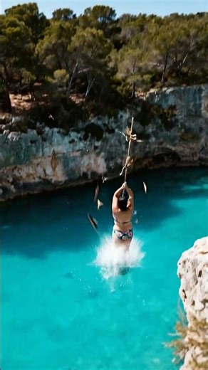 Woman rope swings in nature