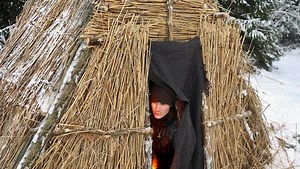 A winter bushcraft build raising a Viking hut together