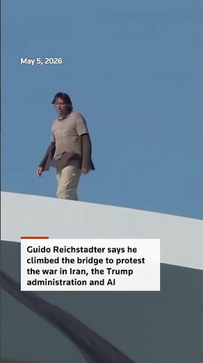 Protester who scaled DC bridge climbs down
