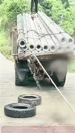 Cement Pipe Unloading Hack: Rope + Tire, Time-Saving and Effortless!