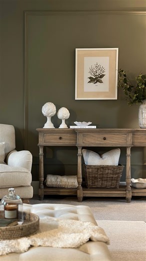 Danielle on Instagram: "Hibernating ☕️ The weather this week has been relentless! 🌧️ A perfect excuse for a cosy night in watching Bridgerton (and swooning over the dresses and interiors) Happy Friday 🥂 Walls: @farrowandball Treron Console table: @lamaisonchic_interiors Botanical wall art, rug, artichoke ornaments, horse ornament, wall light, vase and console basket: @neptunehomeofficial Chair: @darlingsofchelsea *post contains content that previously featured as ads #countryhome #hyggehome #g