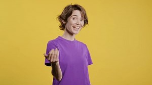 Woman asks join,beckons with inviting hand hugs gesture.Hey you,come on,inviting