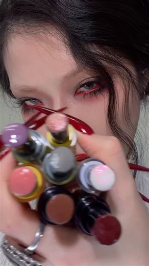 KALEIDOS on Instagram: "A love letter to glossy lips. 💌 Reprogram romance with our Glassload Lip Melts. These balm-gloss hybrids drape the lips in high-shine, high-visibility color with soft goth shades that are equal parts tender and powerful. Infused with cushiony hydration, this formula melts on contact, smoothing and soothing while delivering a lightweight, super glassy finish. Which shade is your muse? ☁️ Lunar Token ☁️ Endgame ☁️ Stranger ☁️ Geek Out ☁️ Cheat Code ☁️ Clean Slate ☁️ Dungeo