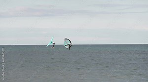 Modern water sport. Hydrofoil ride on the ocean using the wing and the power of the wind. the best place for kitesurfers, video of fit athlete practise hydro foil wing surfing
